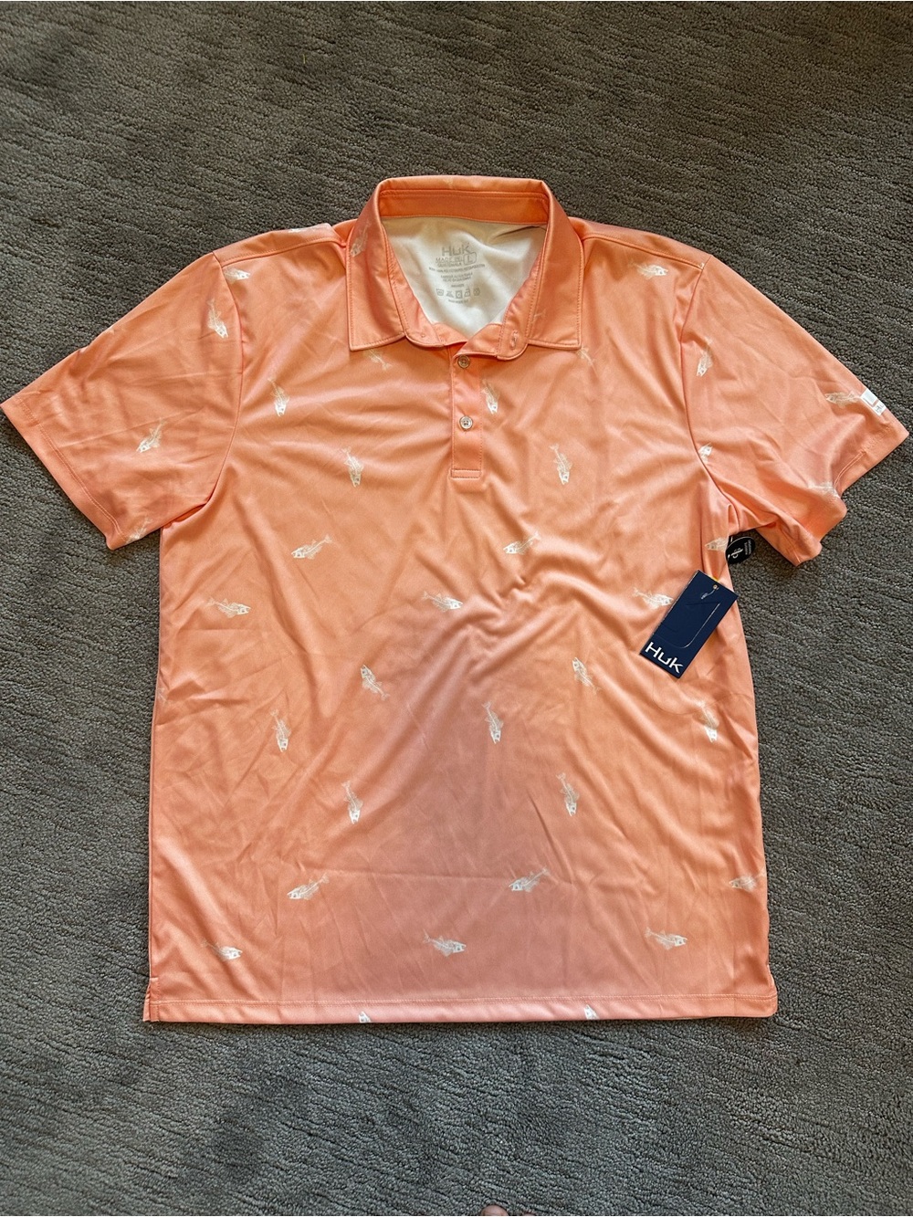 Huk Men’s Coral Polo with Subtle Fish Motif